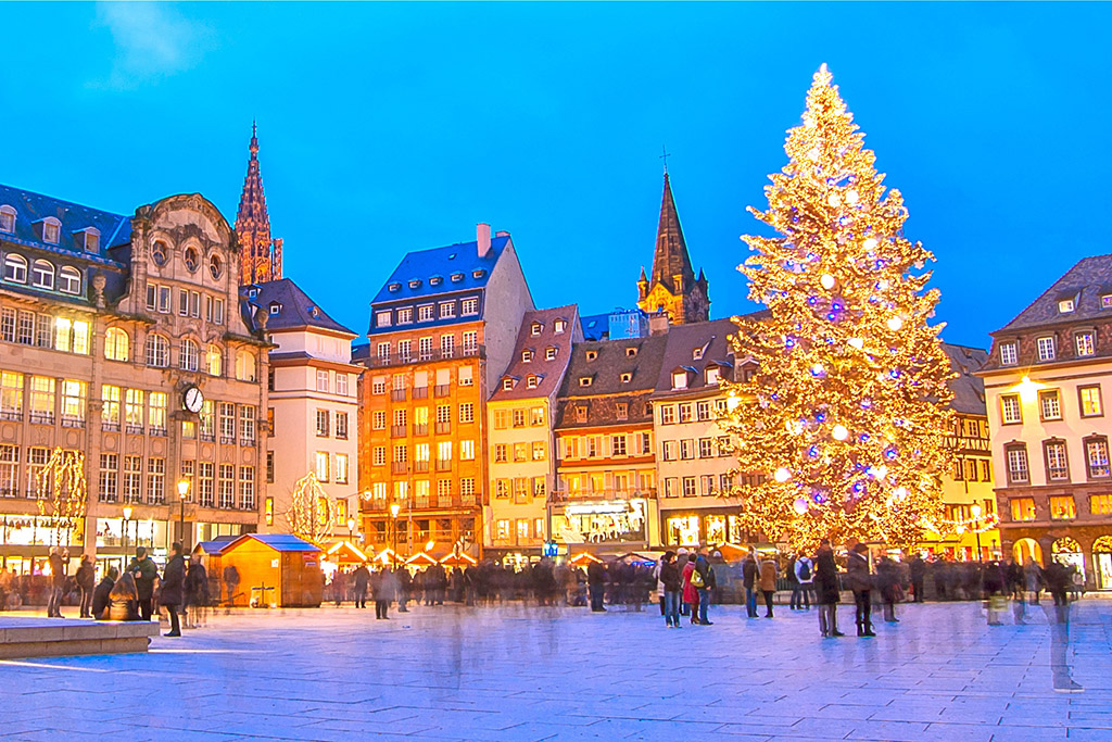 a large christmas tree in a city